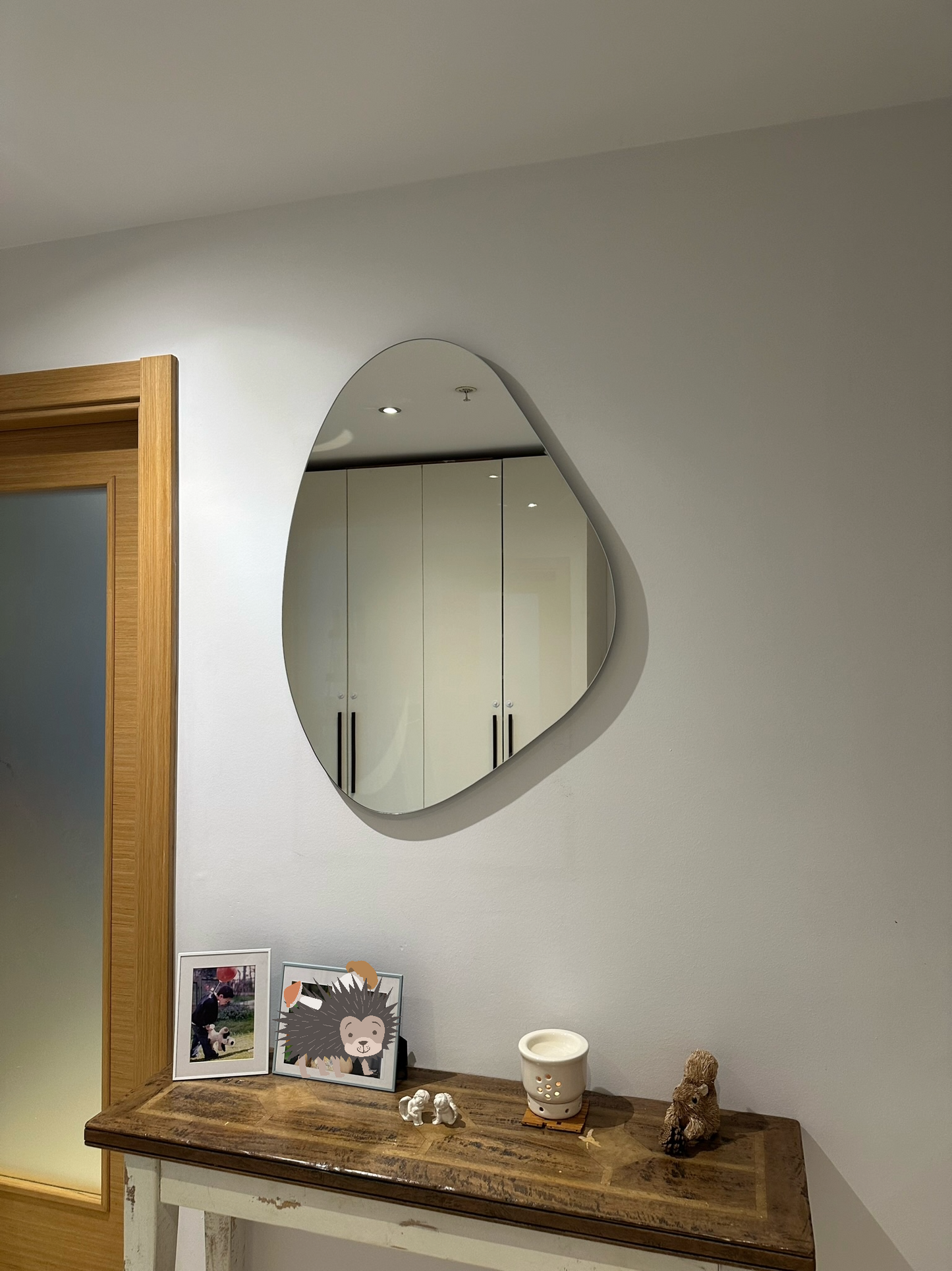 Frameless Asymmetric Mirror