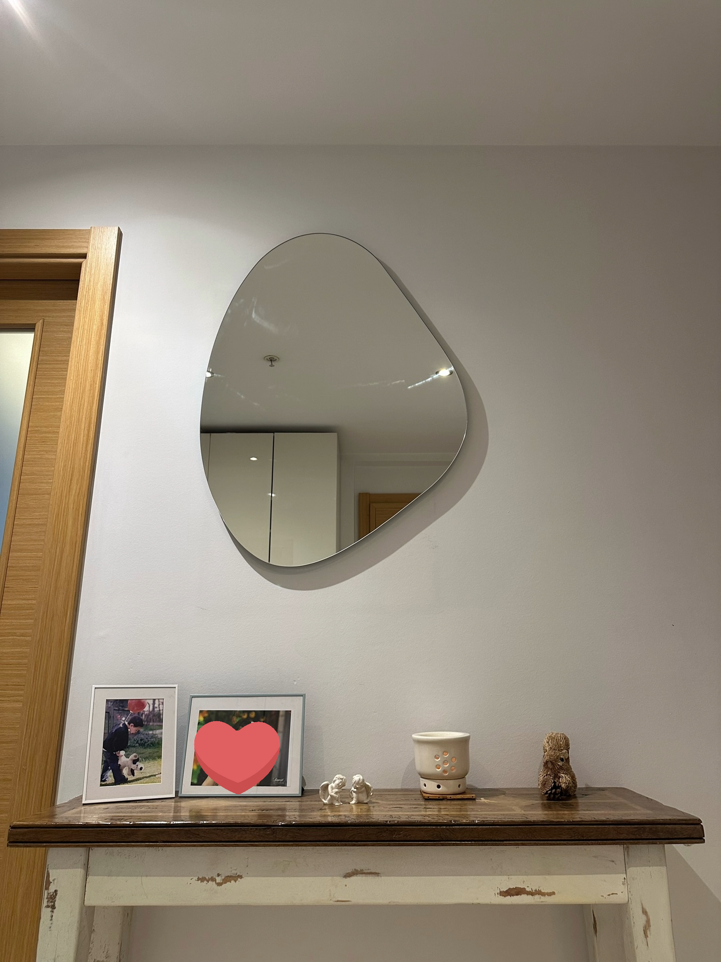 Frameless Asymmetric Mirror