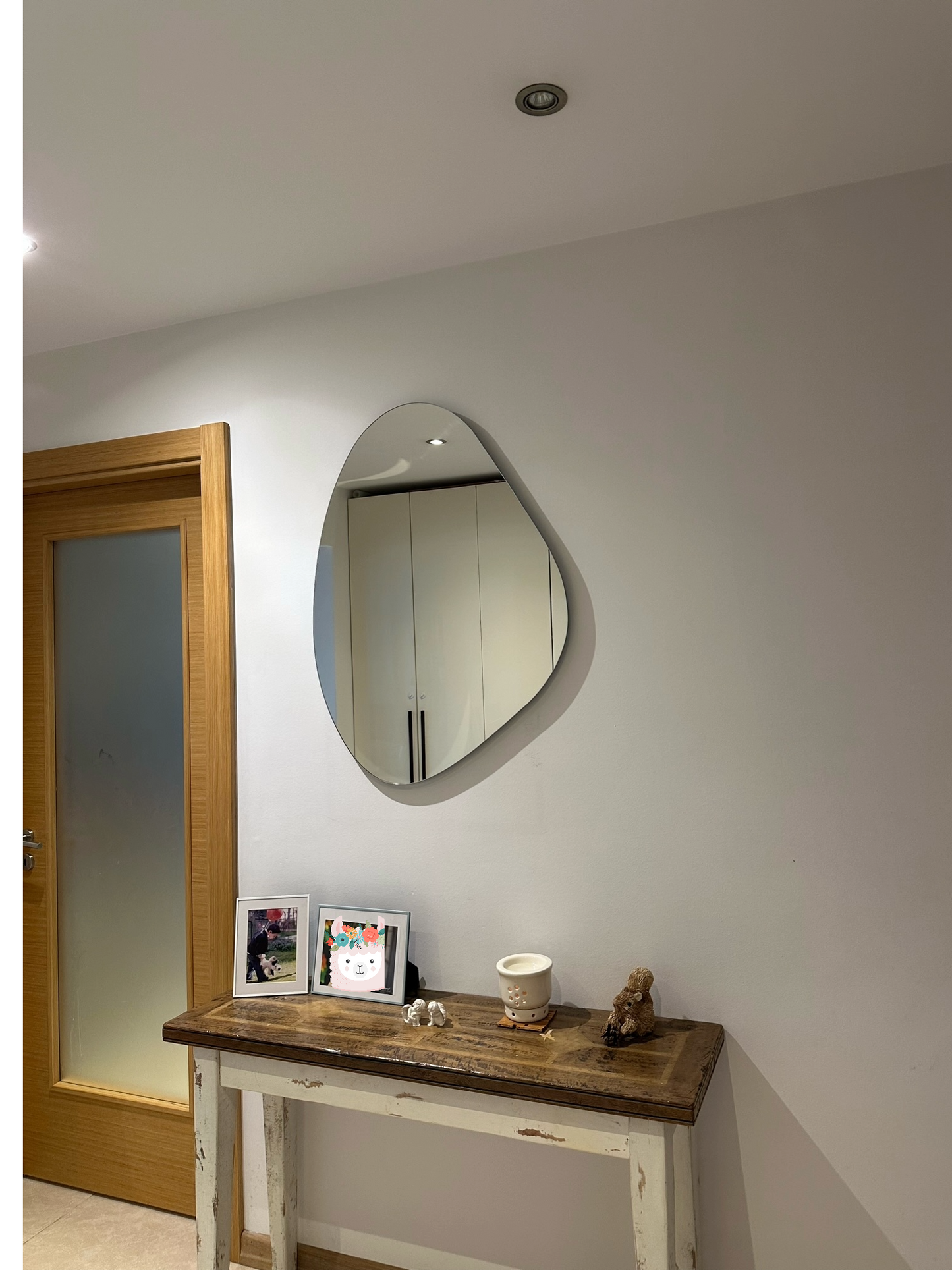 Frameless Asymmetric Mirror